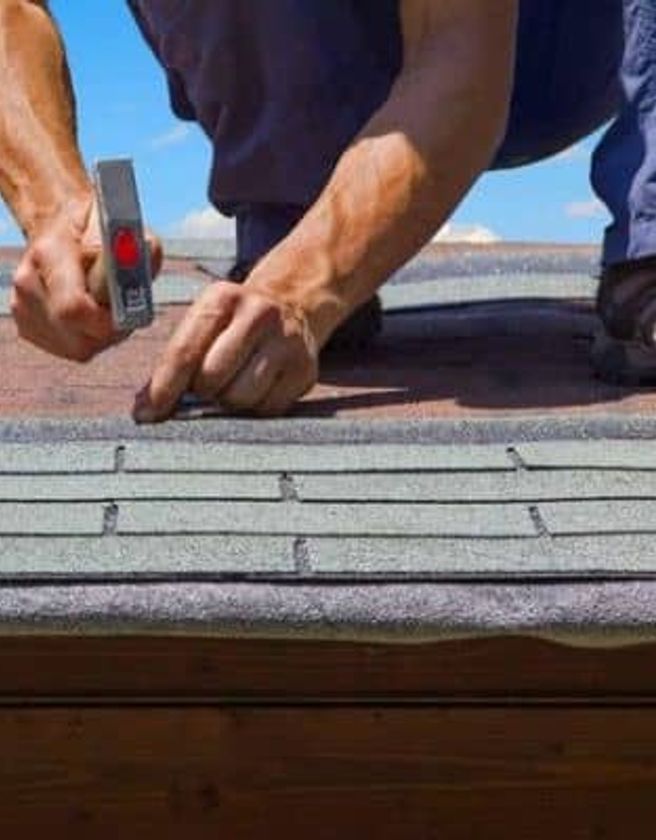 Roofing services, shingles and roofers at work