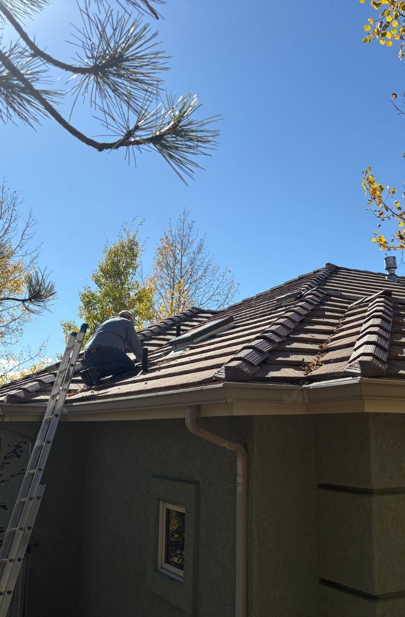 JG Construction working on a wood shingled roof